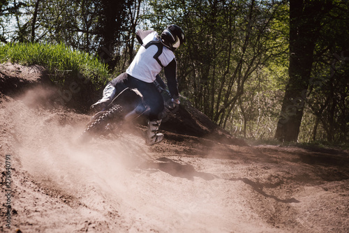 Motocross driver turning photo