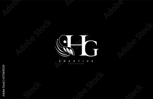 Initial HG letter luxury beauty flourishes ornament monogram logo