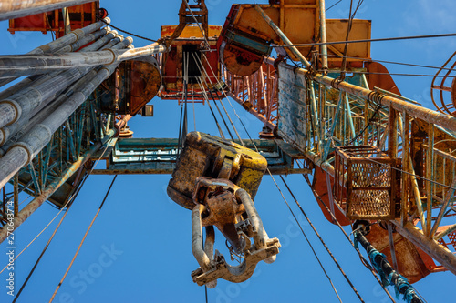 Oil drilling rig operation on the oil platform in oil and gas industry. Industrial concept. Toned.