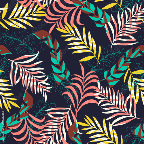 Abstract seamless pattern with tropical leaves on blue background. Vector design. Jungle print. Textiles and printing.