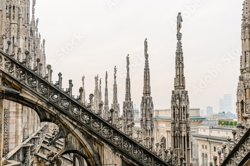 Flying buttress and ornately carved stonework on the roof of the Duomo Milano (Milan Cathedral), Italy © Stephen