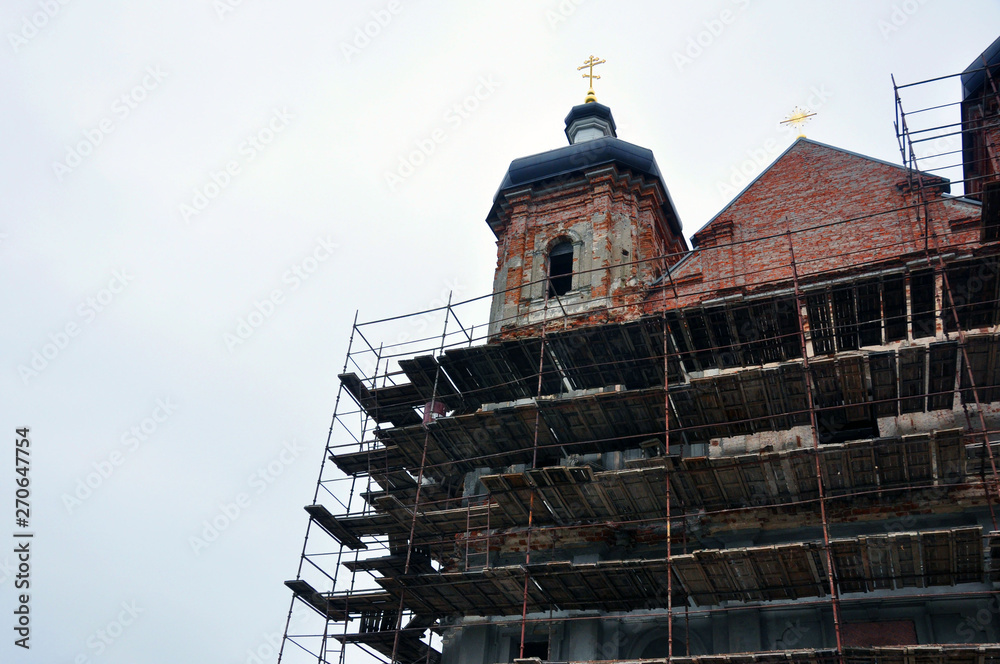 Obraz premium Construction of the church, scaffolding, reconstruction of the temple