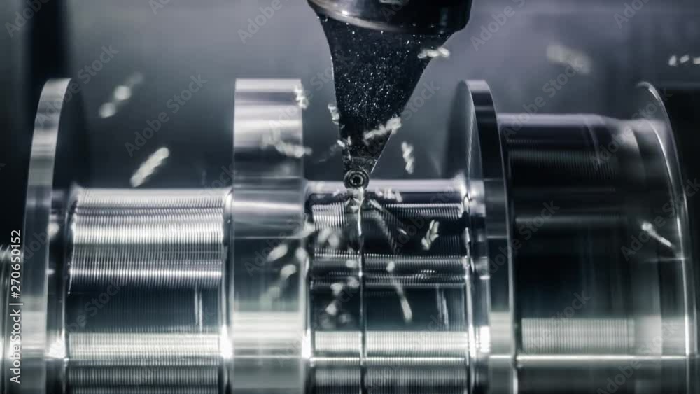 Metalworking CNC lathe milling machine. Cutting metal modern processing technology.