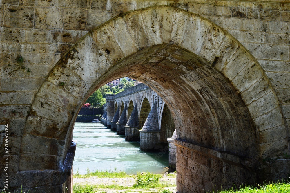 the arch of the old stone bridge