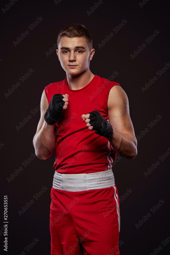 Sportsman, man boxer fighting in gloves. on black background