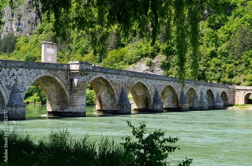 old stone bridge on the river © oljasimovic