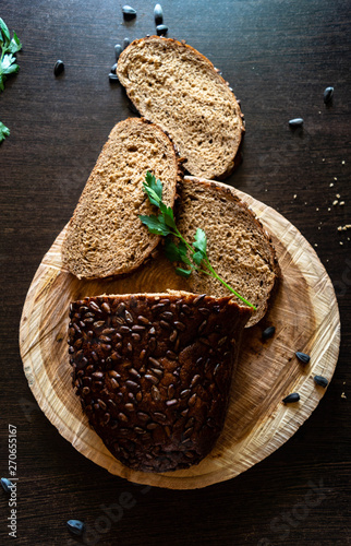 Rye bread. With sunflower seeds. Food photo. Dark Moody.
