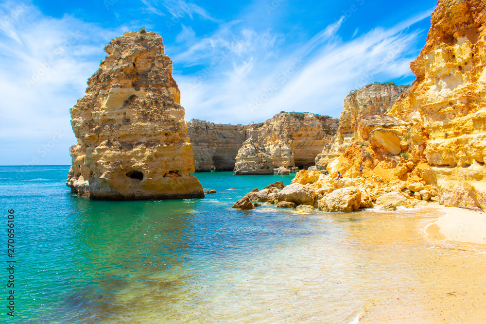 Fototapeta premium Praia de Marinha most beautiful beach in Algarve Portugal. beautiful landscape clear green and blue water cliffs and rock formations on Coast of Atlantic Ocean
