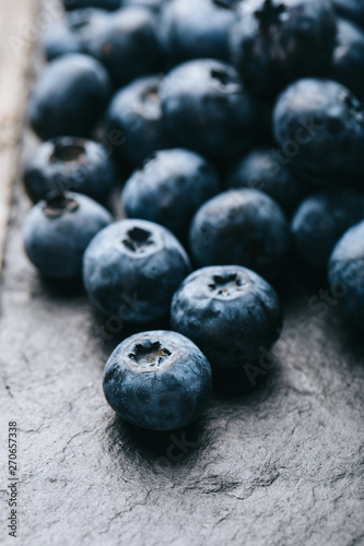 Fresh blueberry background. Texture blueberry berries close up. Vegan and vegetarian concept.