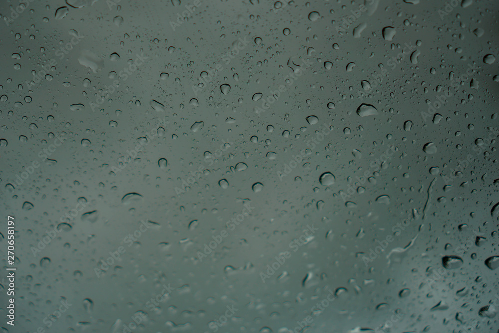 blur backgruond,Rain water on the car glass. blur backgruond,Rain water on the car glass.