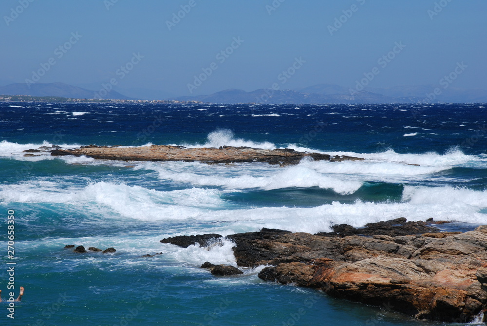 Stormy seas at the Hamolia beach near the city of Athens. Vravrona region, Attica, Greece. Stormy seas at the Hamolia beach near the city of Athens. Vravrona region, Attica, Greece.
