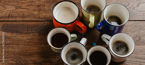 various mugs of coffee, wooden table, top view © yakovlevadaria