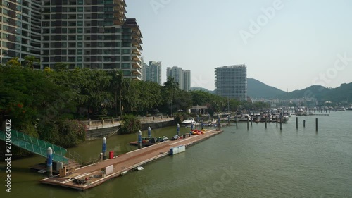 sunny day time sanya city water traffic bay dock bridge panorama 4k hainan china