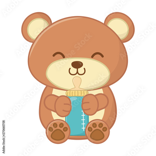 toy bear holding a feeding bottle