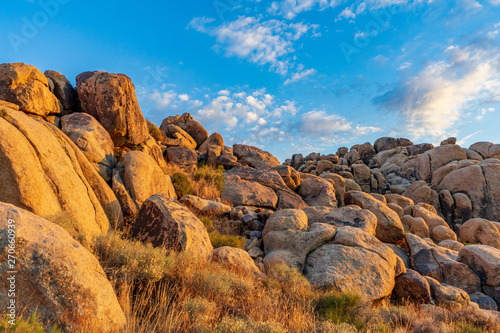 Large boulders on a hill during sunset lighting photo