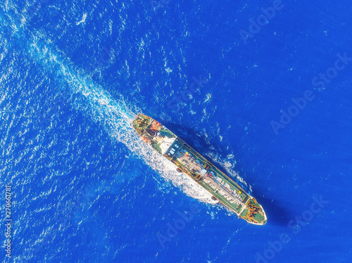 Oil ship chemical tanker sails blue sea. Aerial top view. Concept export © Parilov