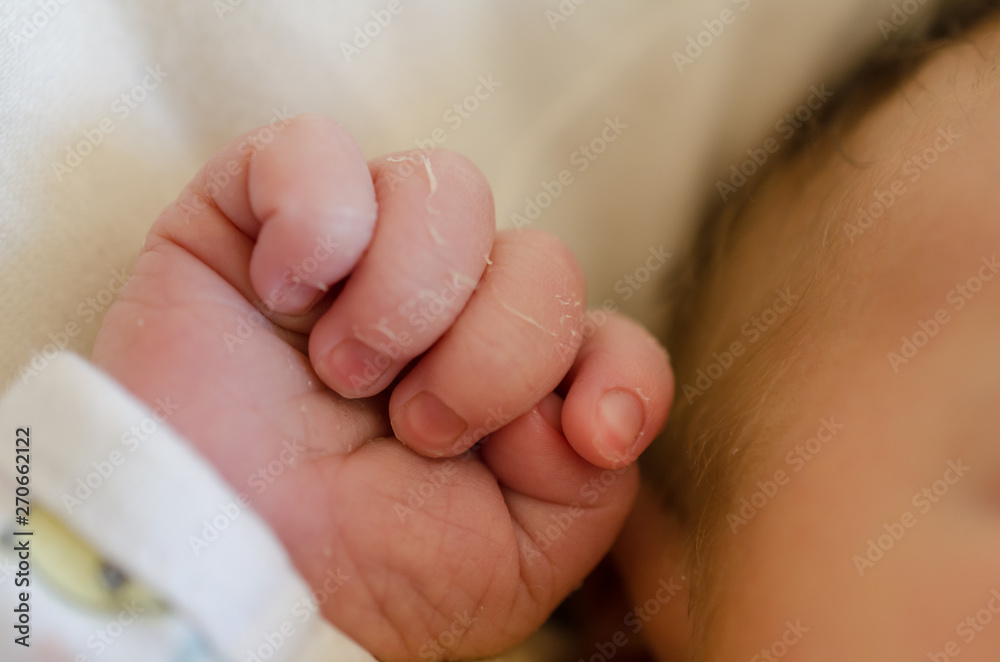 Small hand of newborn baby. Infant fingers. Small hand of newborn baby. Infant fingers.