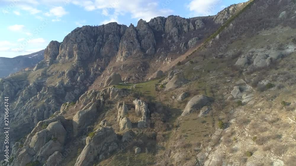 Demerdji, Alushta, Republic of Crimea, Russia - April 1, 2019: Magical view of the Demerdzhi mountain range, Valley of ghosts and Lunar (Solar) glade Demerdji, Alushta, Republic of Crimea, Russia - April 1, 2019: Magical view of the Demerdzhi mountain range, Valley of ghosts and Lunar (Solar) glade