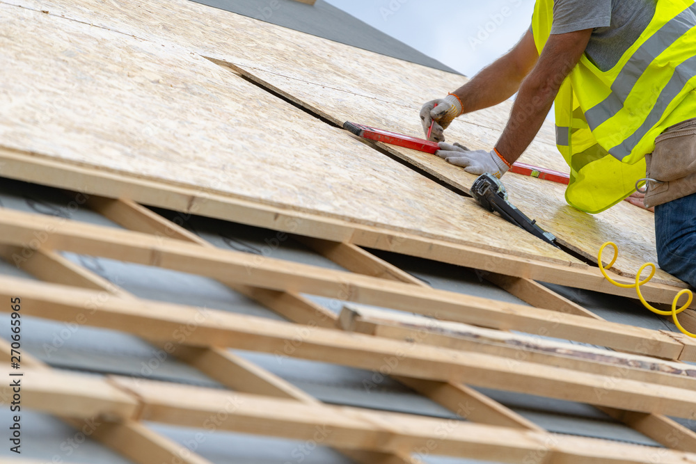 Building construction process of new wooden roof on wood frame house Building construction process of new wooden roof on wood frame house