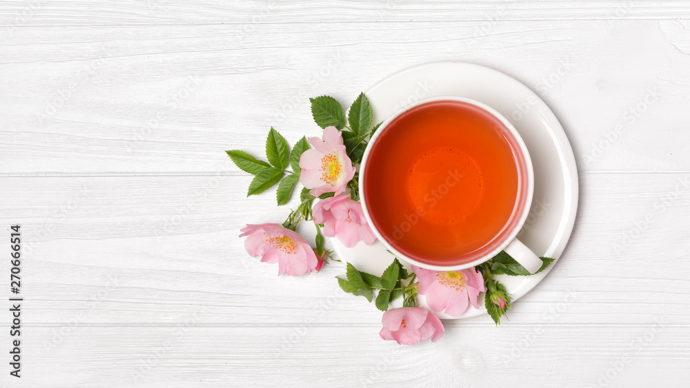 Top view on herbal tea with dog rose flowers for healthy life Top view on herbal tea with dog rose flowers for healthy life