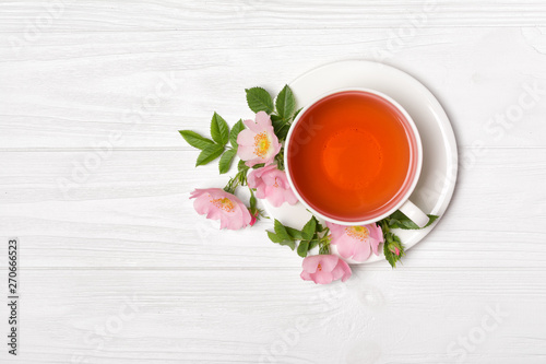 Top view on herbal tea with dog rose flowers for healthy life