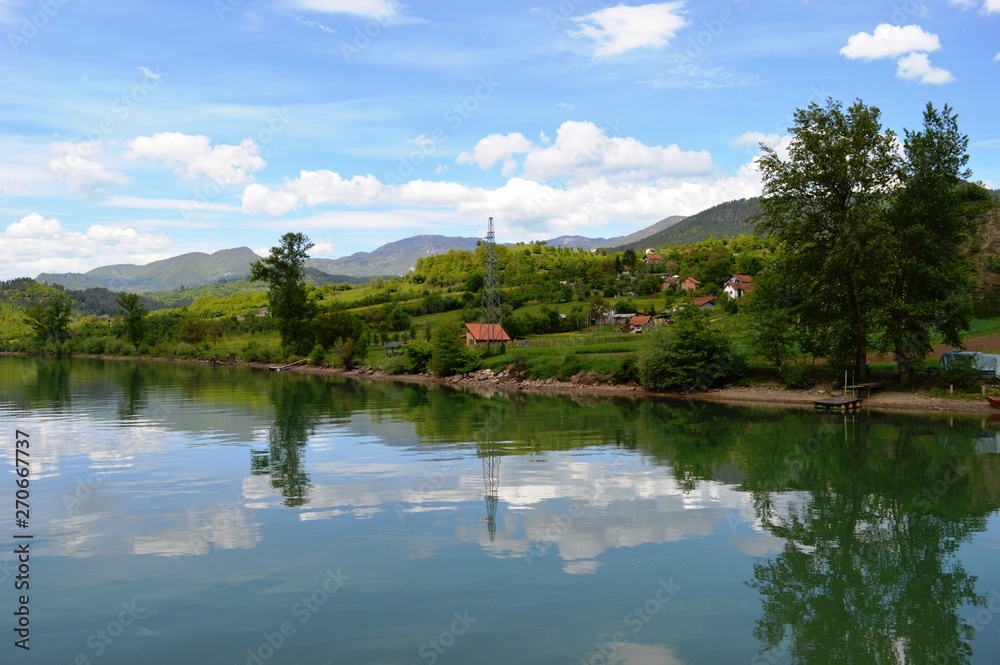 Fototapeta premium reflection in the calm waters of the lake