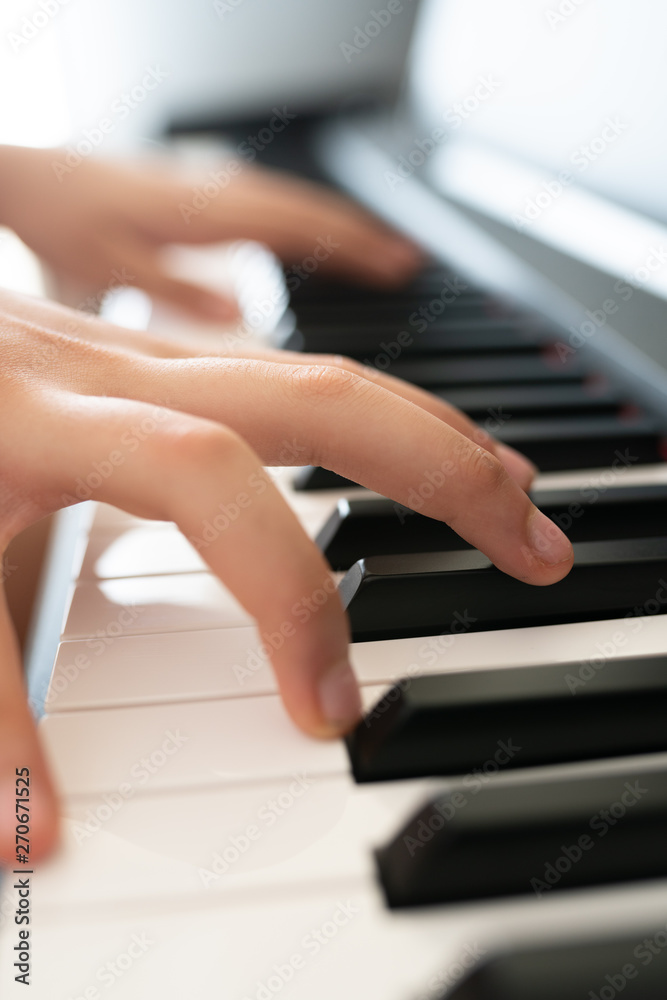 Obraz premium piano keys and playing piano