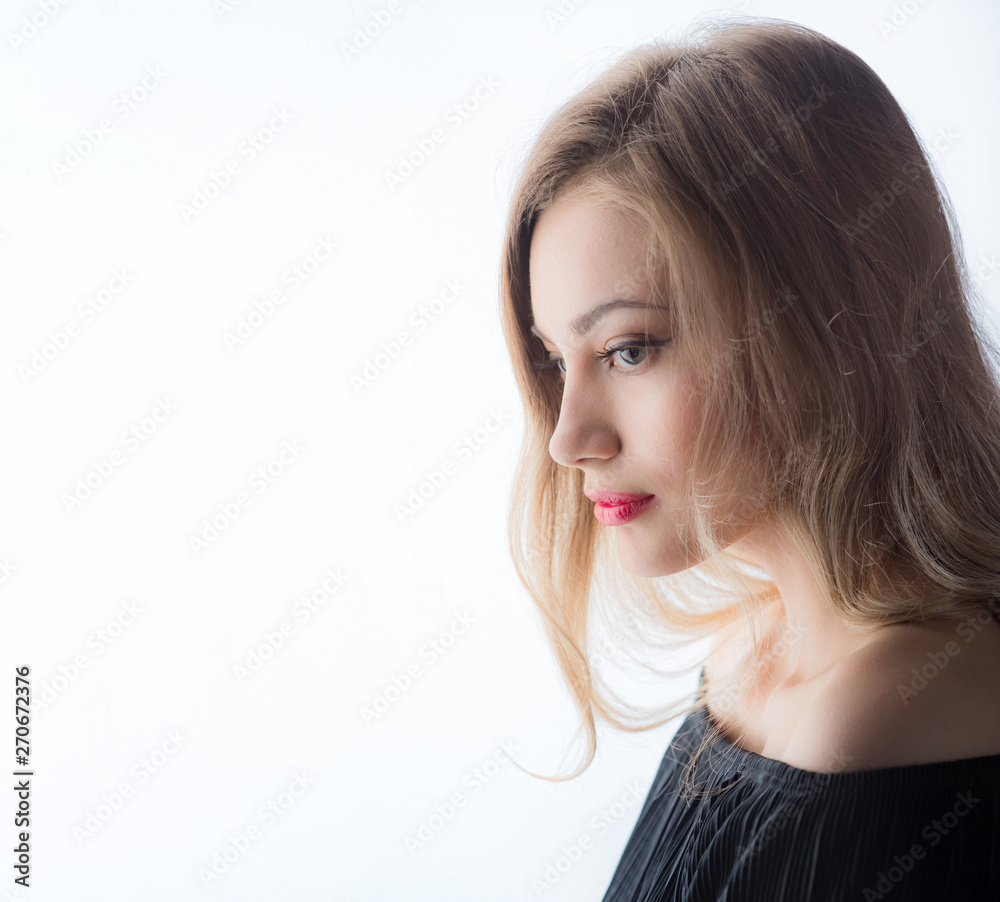 Beautiful ,young blonde with bright red lips and expressive eyes in a black jumpsuit. Beauty portrait of a girl. Emotional and bright appearance. Fashion portrait of a woman. Beautiful ,young blonde with bright red lips and expressive eyes in a black jumpsuit. Beauty portrait of a girl. Emotional and bright appearance. Fashion portrait of a woman.