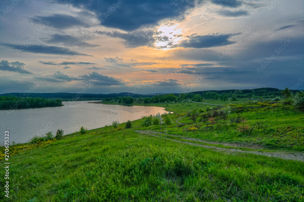 Sunset on the lake summer landscape. Lake with sunset in the evening Sunset on the lake summer landscape. Lake with sunset in the evening