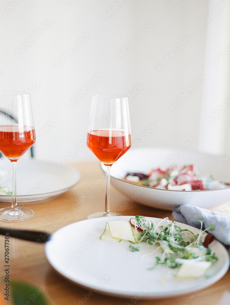 Rose and summer meal on table Rose and summer meal on table