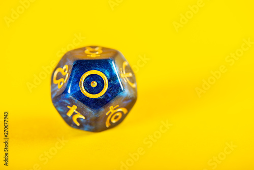 Astrology Dice with symbol of the Sun on Yellow Background
