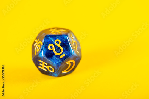 Astrology Dice with symbol of Ketu on Yellow Background