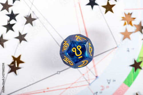 Astrology Dice with symbol of Ketu on Natal Chart Background photo