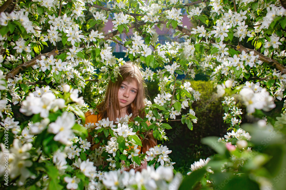 Portrait of a teenage girl in a blooming Apple tree Portrait of a teenage girl in a blooming Apple tree