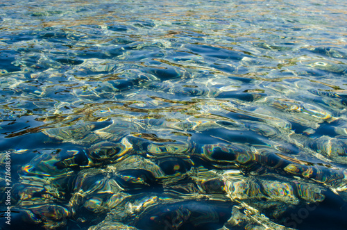 Transparent water in shallow waters at sea. Clean water in the sea. Nature concept with clean sea waters.