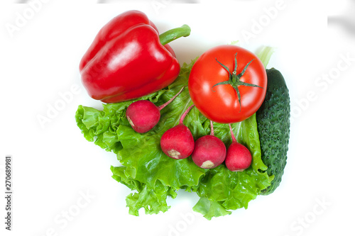 Fresh colorful organic vegetables captured from above (top view, flat lay) isolated on a white background. Layout with free (copy) space. Healthy food conception. Ingredients for salad