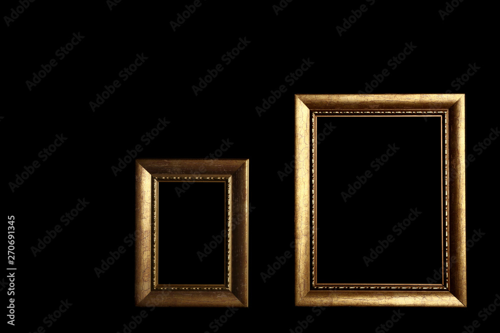 Empty golden frames on black background. Space for design Empty golden frames on black background. Space for design