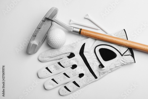 Set of golf equipment on white background, flat lay