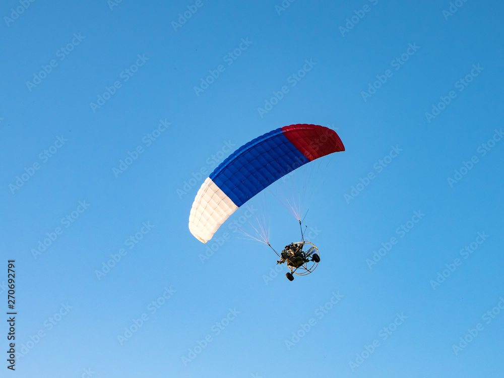 Powered parachute against the blue sky. Powered parachute against the blue sky.