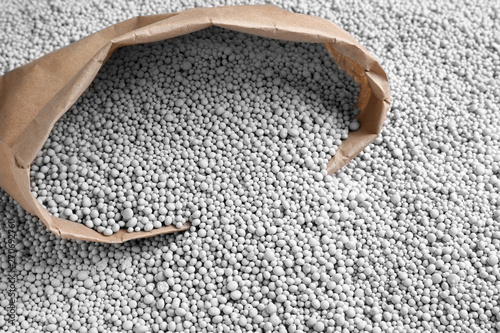 Konstfotografi Paper bag and chemical fertilizer. Gardening season