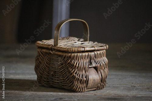 vintage wicker basket on wooden table
