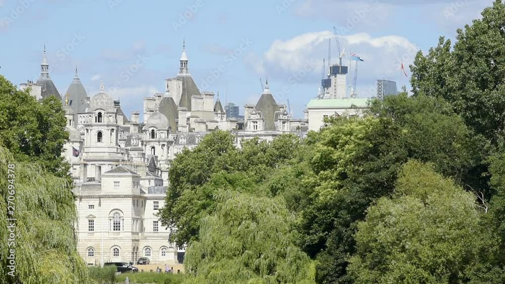 London Eye landscape view with St James Park green lake pond, summer day, closeup Horse Guards Parade building in UK London Eye landscape view with St James Park green lake pond, summer day, closeup Horse Guards Parade building in UK