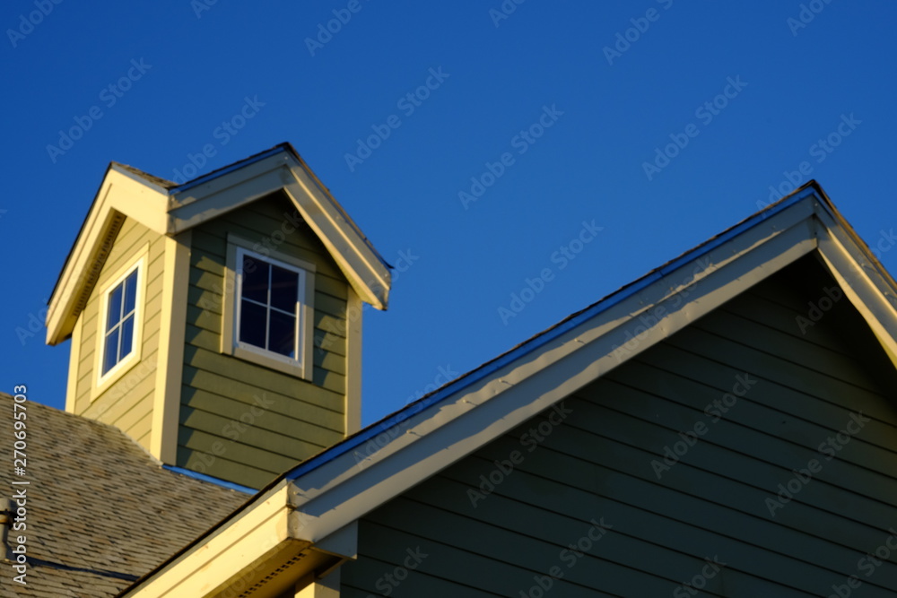 steeple and roofline with blue sky horizontal