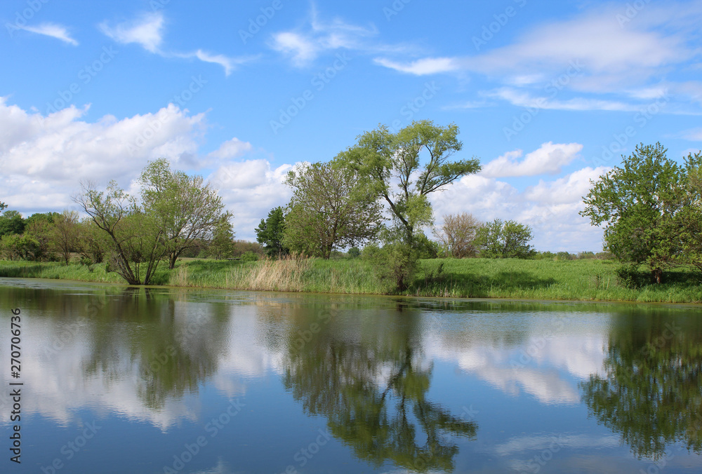 Turtle Pond at Midewin National Tallgrass Prairie with intereting clouds and a beautiful reflection