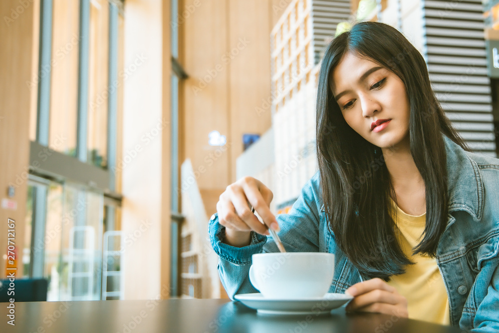 Attractive Asian woman drinking coffee.cheerful girl drinking coffee or tea in morning Attractive Asian woman drinking coffee.cheerful girl drinking coffee or tea in morning
