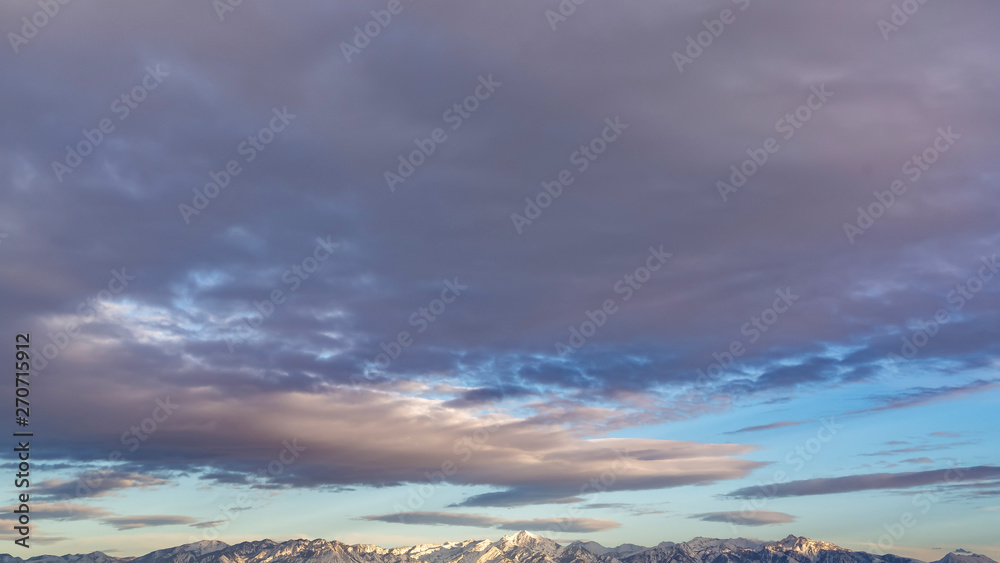 Panorama Panoramic view of a majestic mountain range covered with sharp white snow