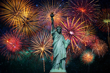 Statue of Liberty over the Multicolor Fireworks Celebrate with the milky way background, 4th of July and Independence day concept