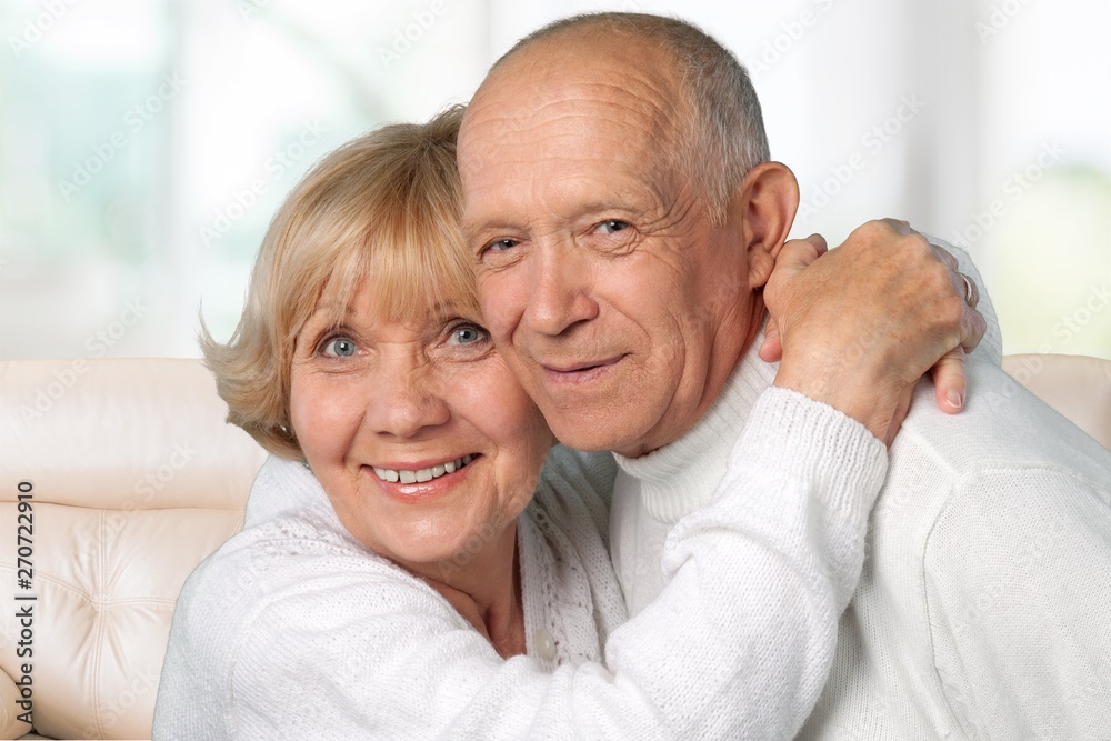 Portrait of happy senior couple smiling at home Portrait of happy senior couple smiling at home