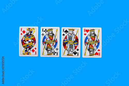 Playing card. Hand with card playing poker .close up of male hand with playing cards and chips at home. Pocker game. Casino cards as background. Concept for games, gambling in casino and sports poker.