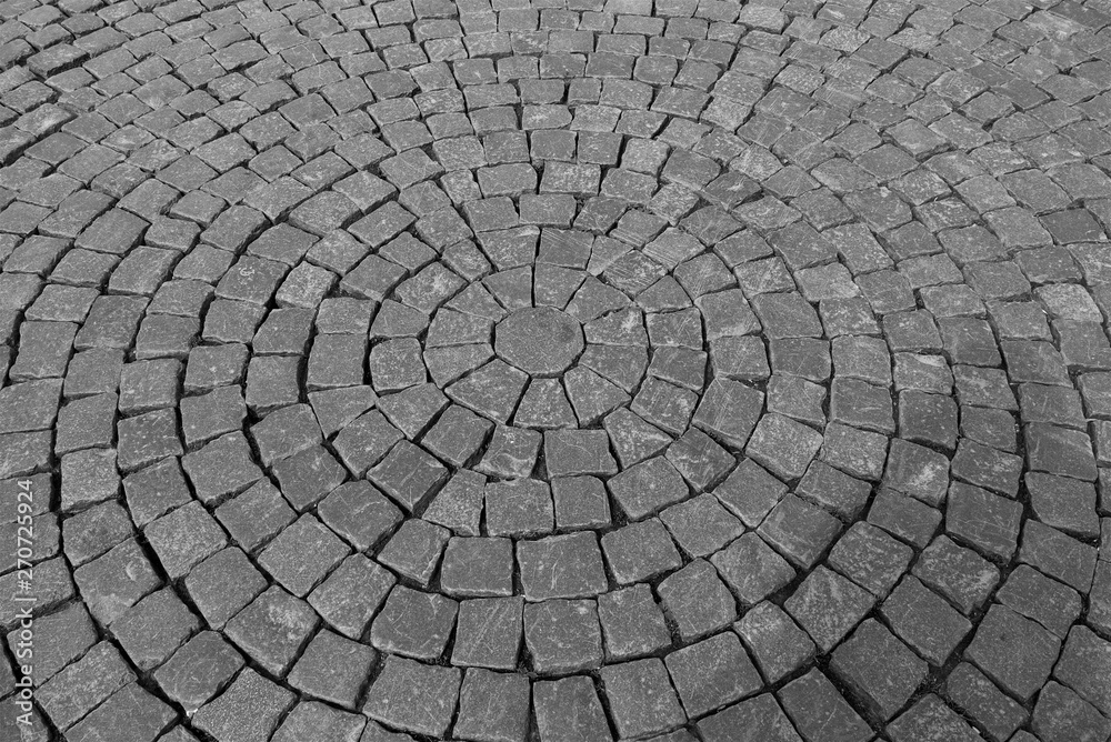 pavement of cobblestonesGray Pavement of cobblestones laid in concentric circles pavement of cobblestonesGray Pavement of cobblestones laid in concentric circles